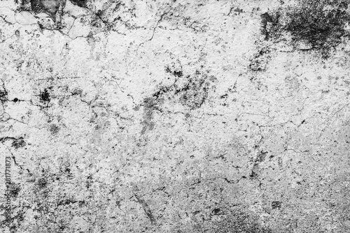 Texture of a concrete wall with cracks and scratches which can be used as a background © chernikovatv