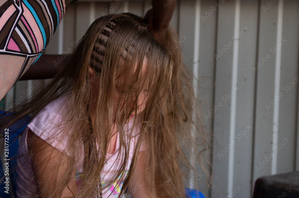 Naklejka premium Portrait of little girl with dreadlocks