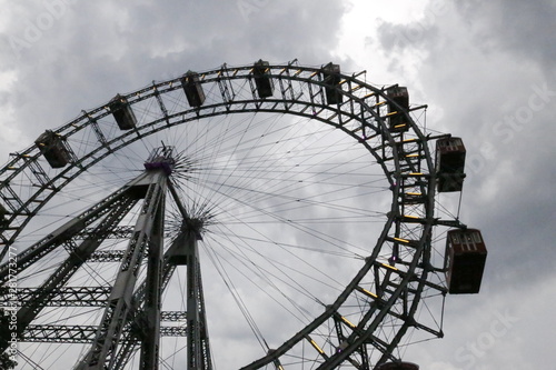 ferris wheel on a background of cloudy sky
