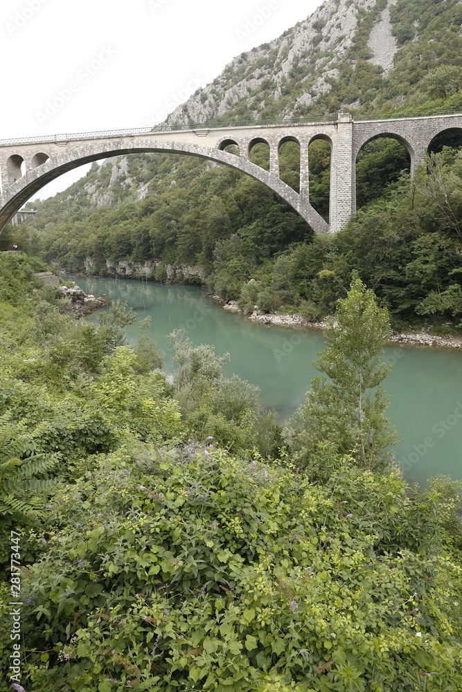 Fototapeta premium Solkan stone railway bridge in Slovenia over the river Soсa