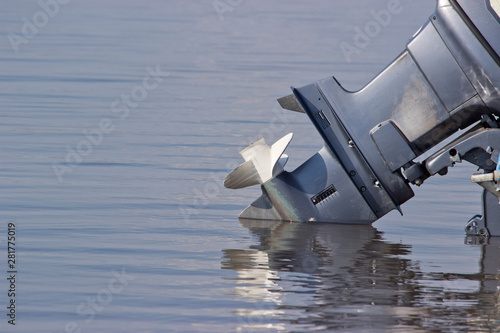 outboard motor lowered into the water photo