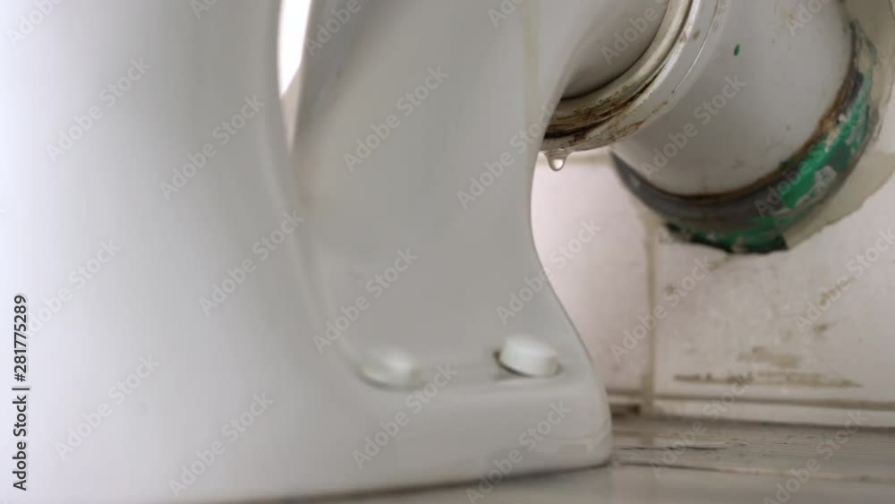 Leaking water from a toilet due to pipe blockage or worn out parts