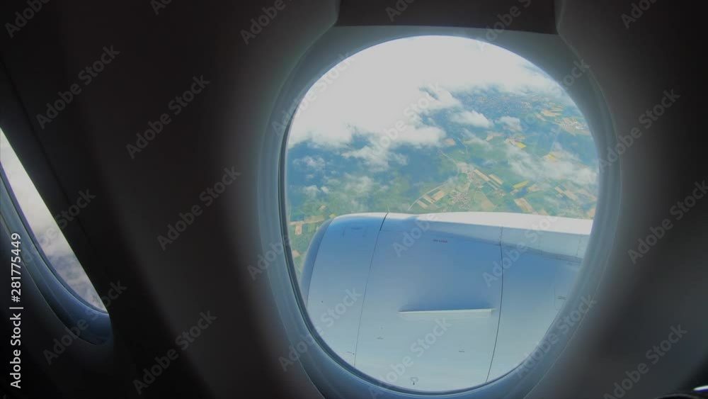 View from the window of a passenger airplane of a landscape View from the window of a passenger airplane of a landscape