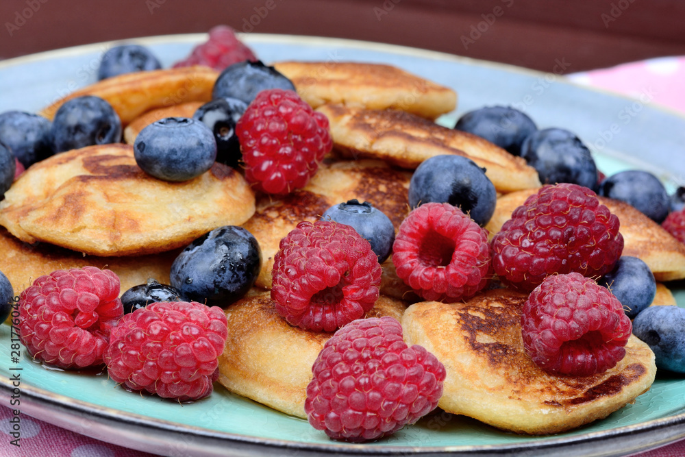 Delicious pancakes with fresh berries and syrup maple Delicious pancakes with fresh berries and syrup maple