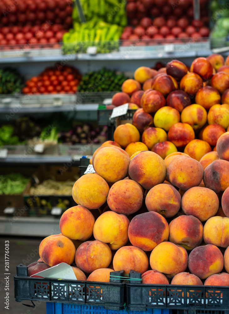 Stack of peaches in the market.
