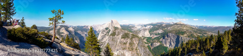 Yosemite National Park, California / USA - September 2nd, 2012: Panoramic view from the Glacier Point with the Half Dome in the center / Some visitors watching the views from a viewpoint telescope © Manel Vinuesa