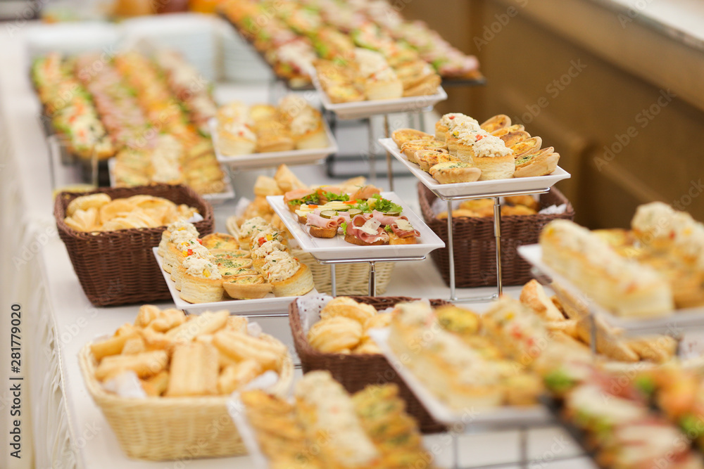 Shallow depth of field image with appetizers on a table at an event, provided by a catering company
