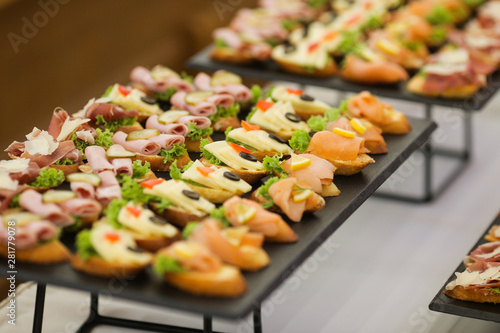 Εκτύπωση καμβά Shallow depth of field image with appetizers on a table at an event, provided by