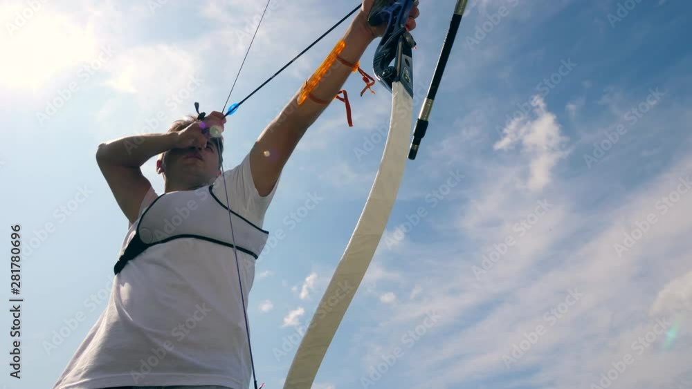 Archer is pulling the string on the modern bow Archer is pulling the string on the modern bow