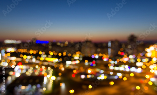 Night cityscape bokeh, abstract blur defocused background at evening time