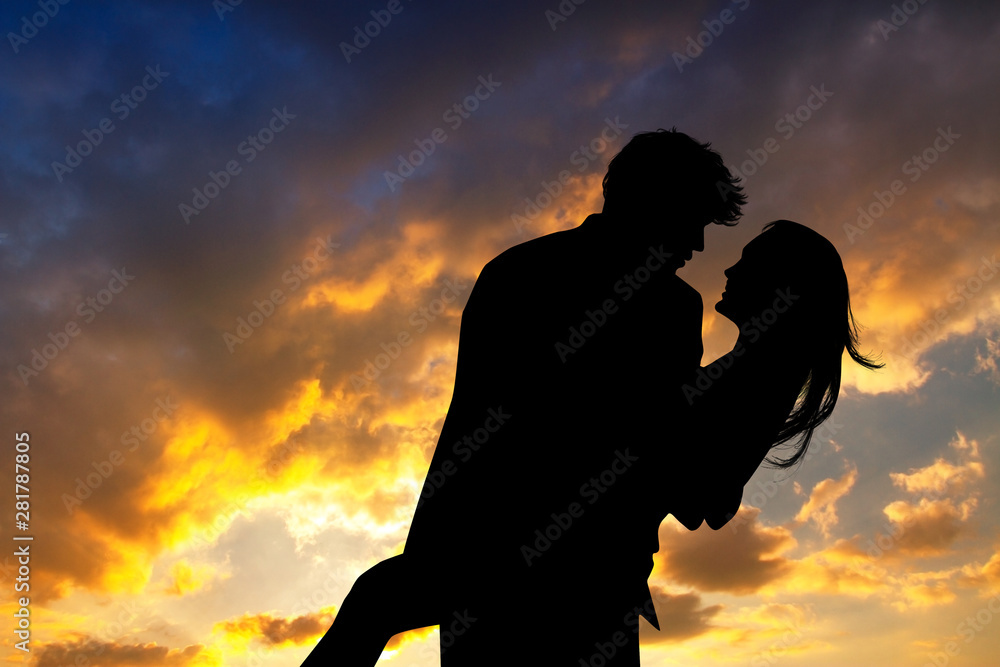 Fototapeta premium loving couple at sunset