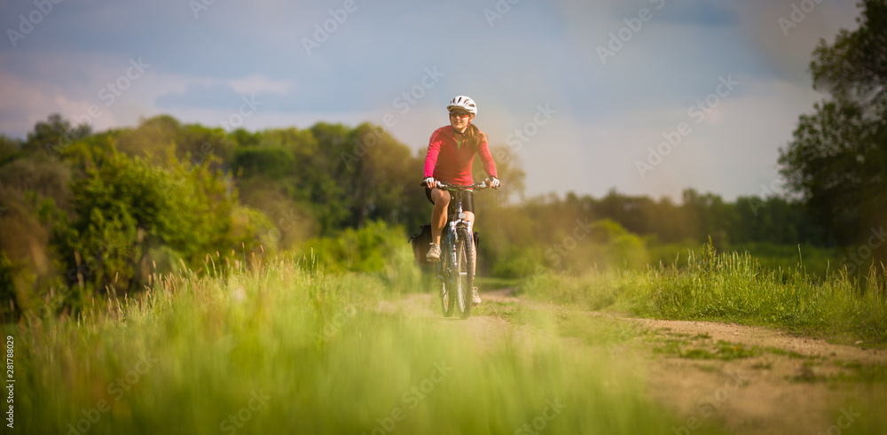 Female cyclist outdoors on her mountain bike