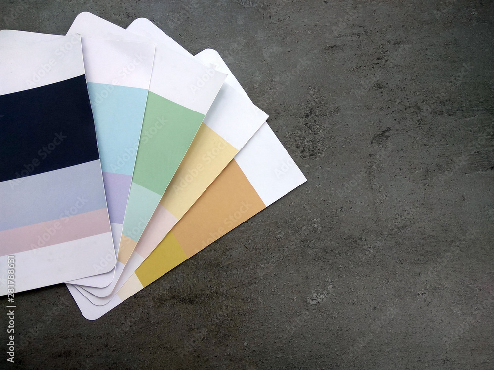 Close up photo of color palettes on concrete background