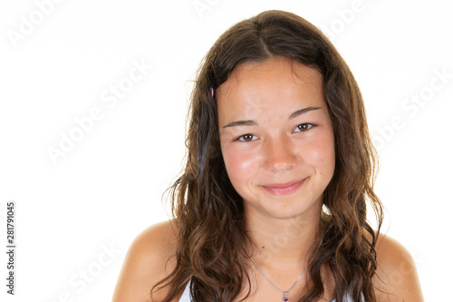 Portrait of cheerful teenager girl with copy space on white background