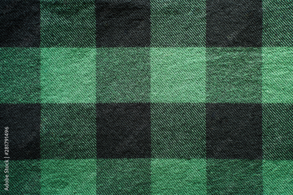 Fabric in a cage. Black and green square pattern. Clothes Empty Background Fabric in a cage. Black and green square pattern. Clothes Empty Background