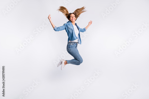 Full length size body photo of cheerful charming optimistic lady jumping up isolated grey background copyspace