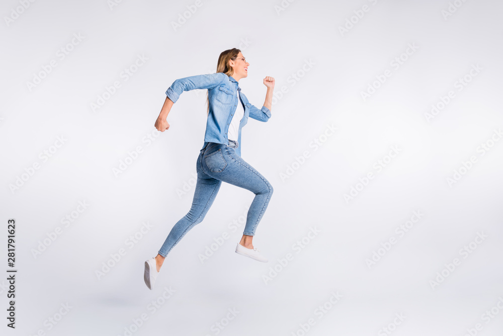 Full length body size photo of running fast energetic lady isolated grey background