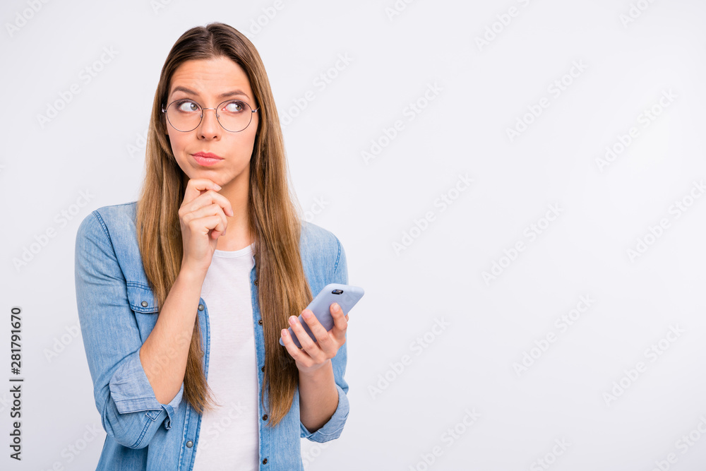 Close up photo of pretty confident focused concentrated lady using telephone in hand isolated grey background Close up photo of pretty confident focused concentrated lady using telephone in hand isolated grey background