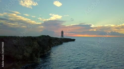 Cliffs on seashore at sunset, Yomitan, Okinawa Prefecture, Japan photo