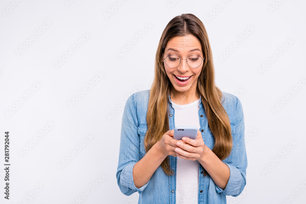 Photo of funny funky lady using her interesting digital gadget isolated grey background Photo of funny funky lady using her interesting digital gadget isolated grey background