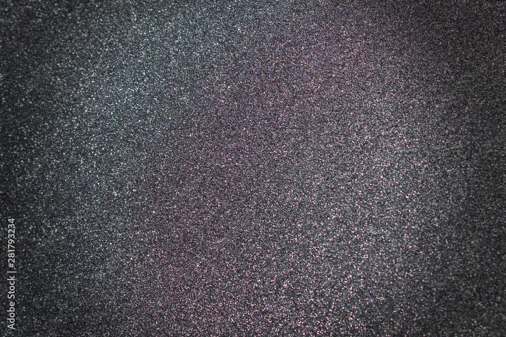 Obraz premium Schwarzer glitzernder Hintergrund mit Schatten