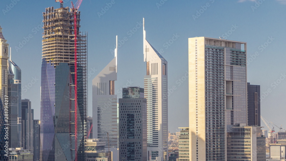 Aerial view on downtown and financial district in Dubai timelapse, United Arab Emirates with skyscrapers and highways.