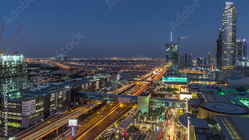 Aerial view of Financial center road day to night timelapse with under construction building