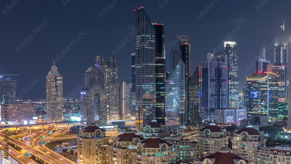 Aerial view of illuminated skyscrapers and road junction in Dubai timelapse Aerial view of illuminated skyscrapers and road junction in Dubai timelapse