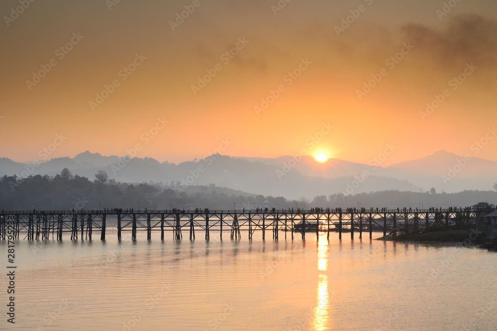 Landscape of the wooden bridge in the morning during the sunrise. The Mon Bridge at Sangkhla Buri District Kanchanaburi Province, Thailand.