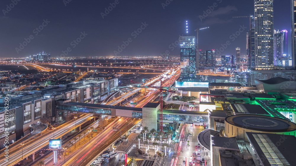 Aerial view of Financial center road night timelapse with under construction building