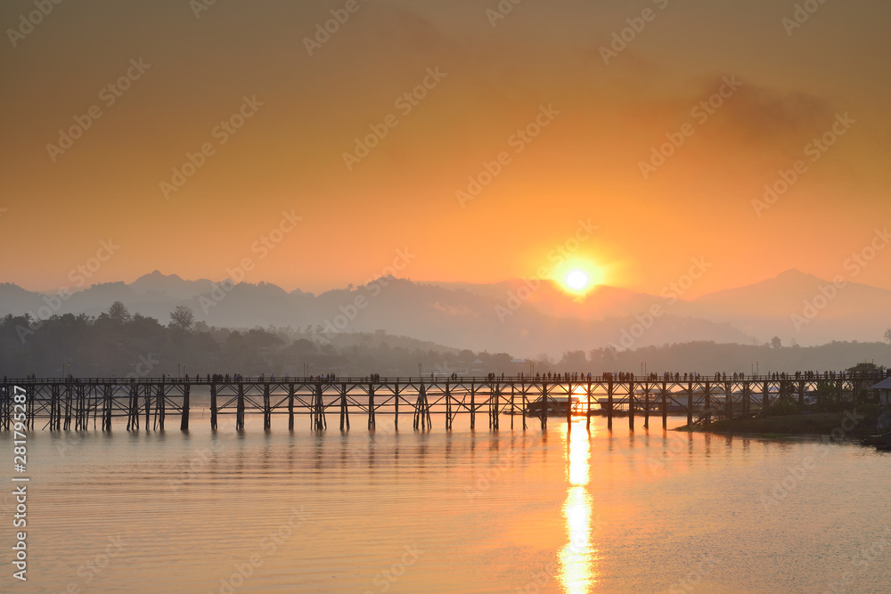 Landscape of the wooden bridge in the morning during the sunrise. The Mon Bridge at Sangkhla Buri District Kanchanaburi Province, Thailand.