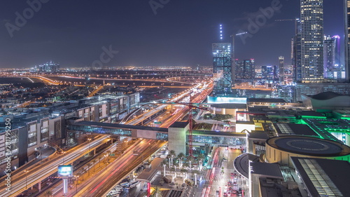 Aerial view of Financial center road night timelapse with under construction building