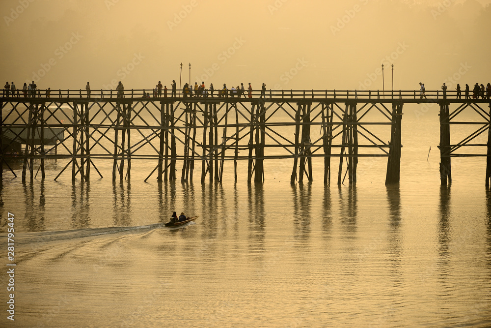 Landscape of the wooden bridge in the morning during the sunrise. The Mon Bridge at Sangkhla Buri District Kanchanaburi Province, Thailand.