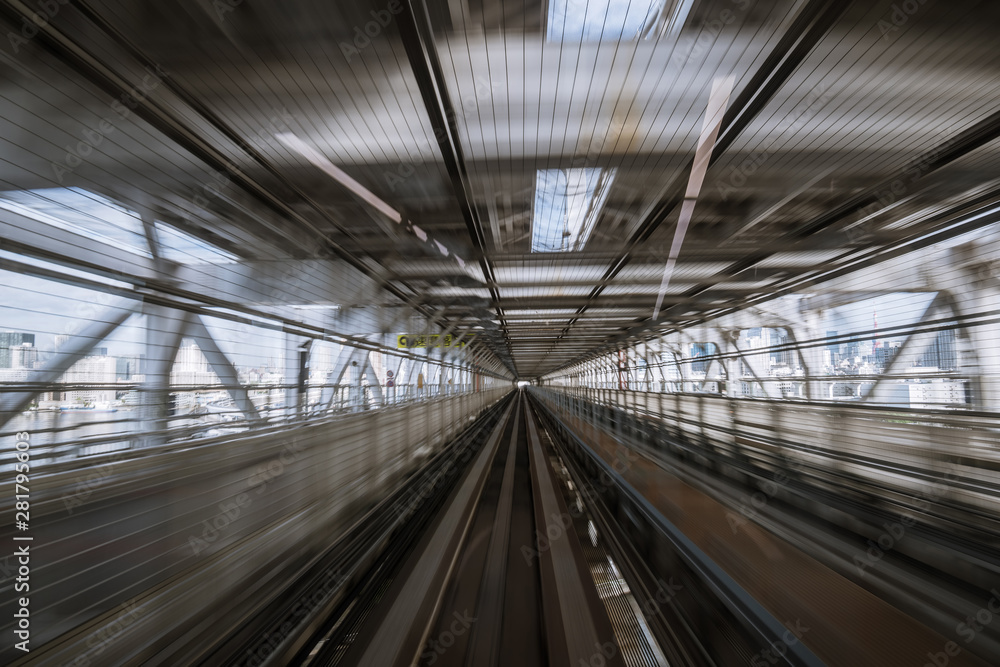 motion-blurred view from a moving train running in tunnel motion-blurred view from a moving train running in tunnel