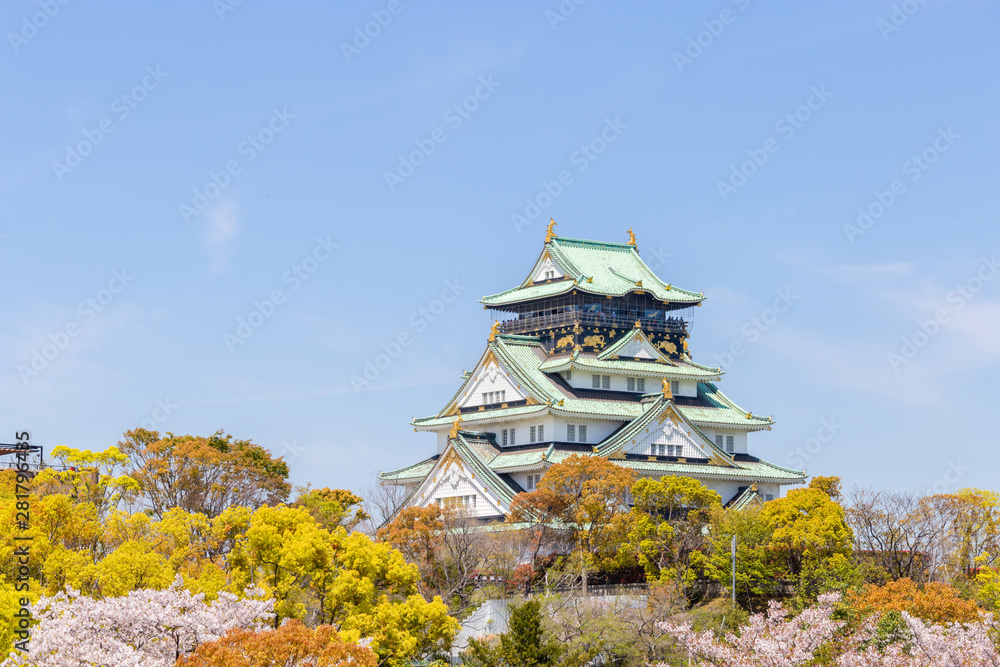 Osaka castle with cherry blossom foregrounds. Japanese spring seasons beautiful scene in Japan Osaka castle with cherry blossom foregrounds. Japanese spring seasons beautiful scene in Japan