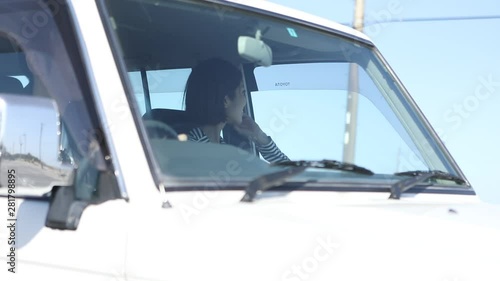 View of couple in car, Kujukuri, Chiba Prefecture, Japan photo