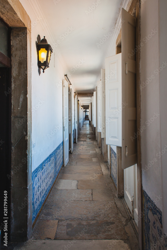 a long corridor in a castle a long corridor in a castle
