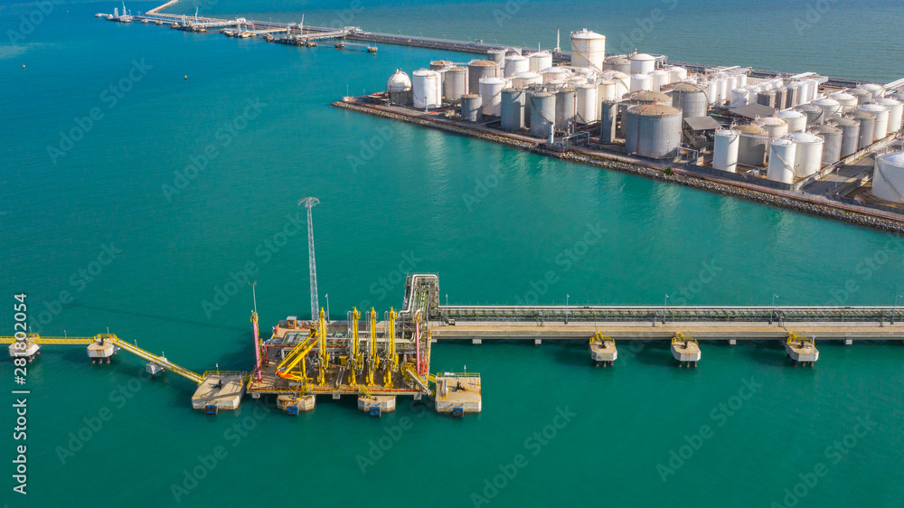 Aerial view loading arm oil and gas refinery at commercial port, Tank