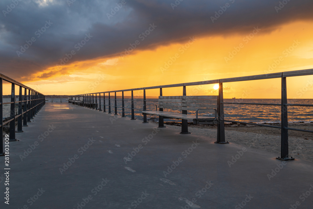 Dramatic summer sunset over sea. Scenic landscape with pier on the sea during beautiful sunset. Sweden