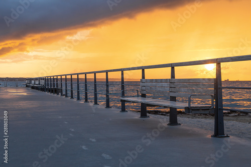 Dramatic summer sunset over sea. Scenic landscape with pier on the sea during beautiful sunset. Sweden