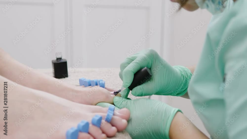 Woman having pedicure at beauty salon Woman having pedicure at beauty salon