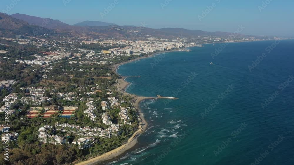 Aerial view of cityscape of Marbella, famous summer resort city and tourist destination in Costa del Sol, beaches and Mediterranean Sea - landscape panorama of Andalusia from above, Spain, Europe Aerial view of cityscape of Marbella, famous summer resort city and tourist destination in Costa del Sol, beaches and Mediterranean Sea - landscape panorama of Andalusia from above, Spain, Europe