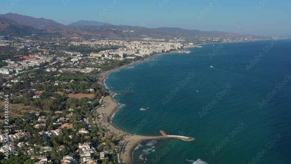 Aerial view of cityscape of Marbella, famous summer resort city and tourist destination in Costa del Sol, beaches and Mediterranean Sea - landscape panorama of Andalusia from above, Spain, Europe Aerial view of cityscape of Marbella, famous summer resort city and tourist destination in Costa del Sol, beaches and Mediterranean Sea - landscape panorama of Andalusia from above, Spain, Europe