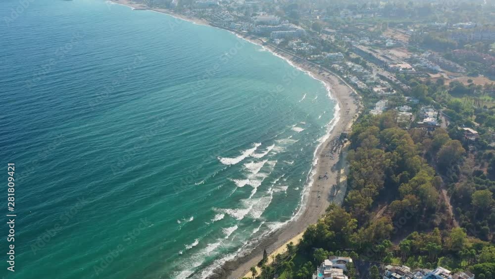 Aerial view of cityscape of Marbella, famous summer resort city and tourist destination in Costa del Sol, beaches and Mediterranean Sea - landscape panorama of Andalusia from above, Spain, Europe Aerial view of cityscape of Marbella, famous summer resort city and tourist destination in Costa del Sol, beaches and Mediterranean Sea - landscape panorama of Andalusia from above, Spain, Europe