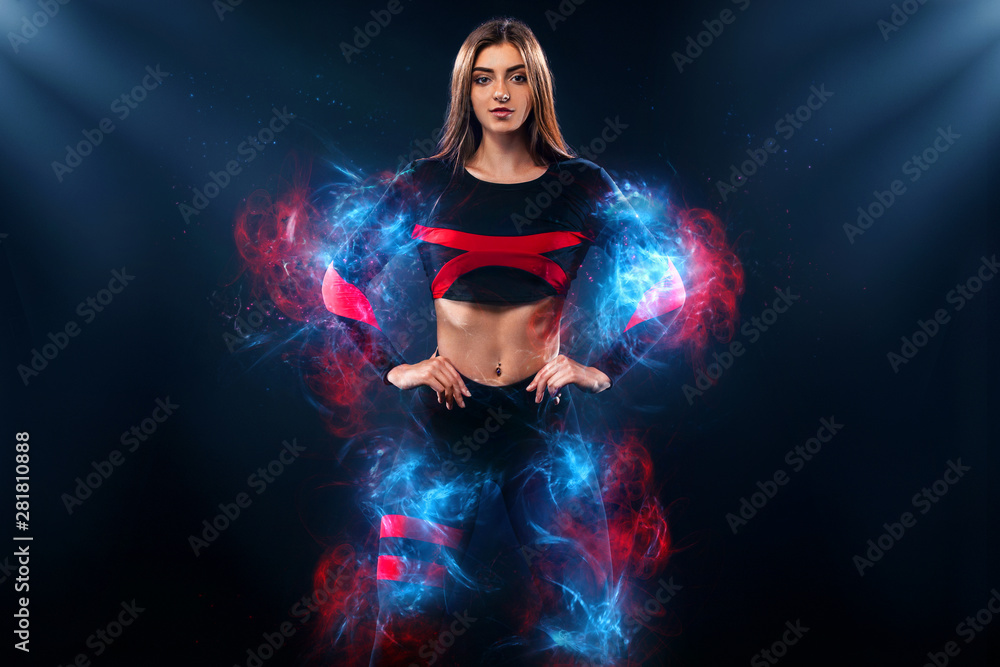 Strong athletic woman , posing on black background wearing in sportswear. Energy fitness and sport motivation. Copy space.