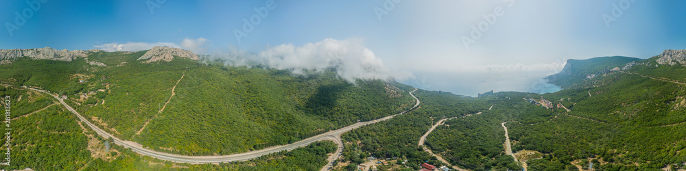 Crimea trip: panoramic view of seaside resort city, mountains and roads