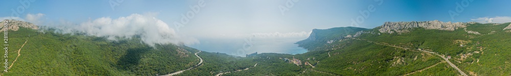 Crimea trip: panoramic view of seaside resort city, mountains and roads