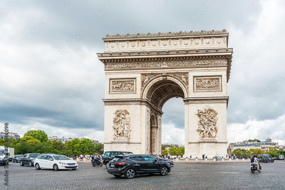 PARIS, FRANCE - July 31, 2019: Arc de Triomphe in Paris, one of the most famous monuments, Paris, France. PARIS, FRANCE - July 31, 2019: Arc de Triomphe in Paris, one of the most famous monuments, Paris, France.
