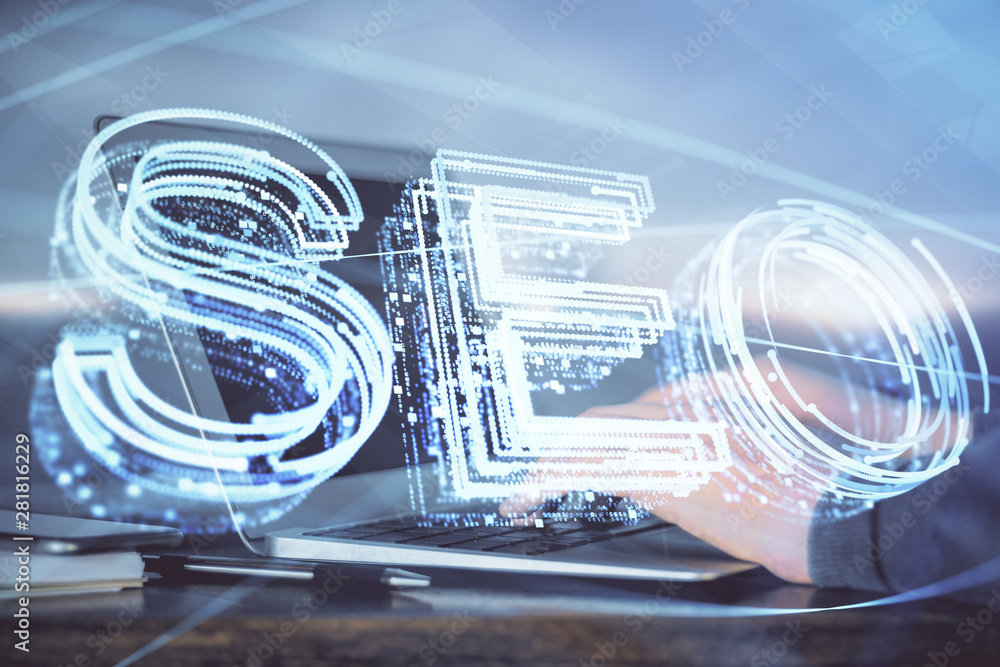 Double exposure of seo icon with man working on computer on background. Concept of search engine optimization. Double exposure of seo icon with man working on computer on background. Concept of search engine optimization.