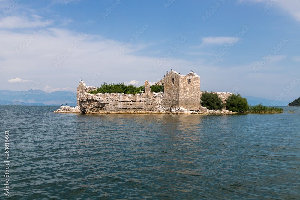 ancient ruins of the Turkish fortress prison on Grmozur island in Lake Skadar in Montenegro.